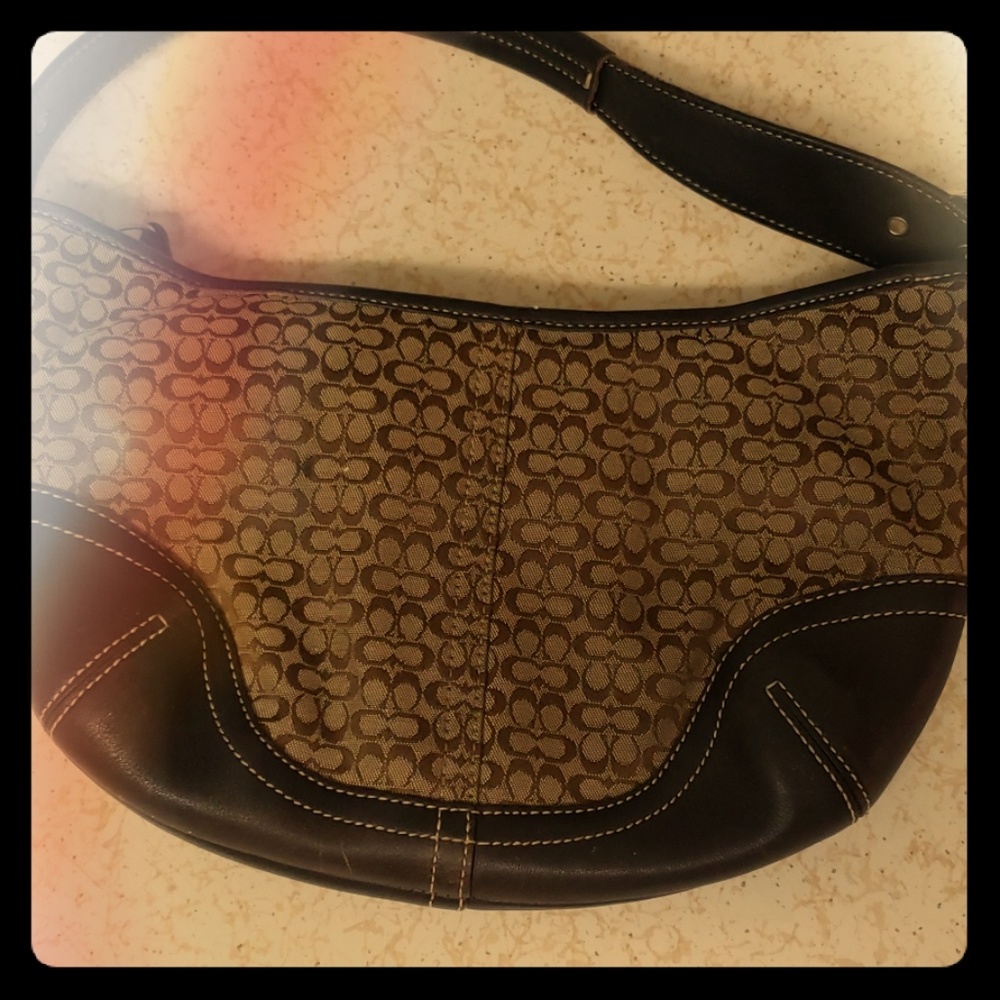 Coach monogram signature hobo hand bag.